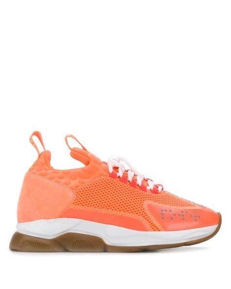 Versace: Orange Cross Chainer Sneakers 